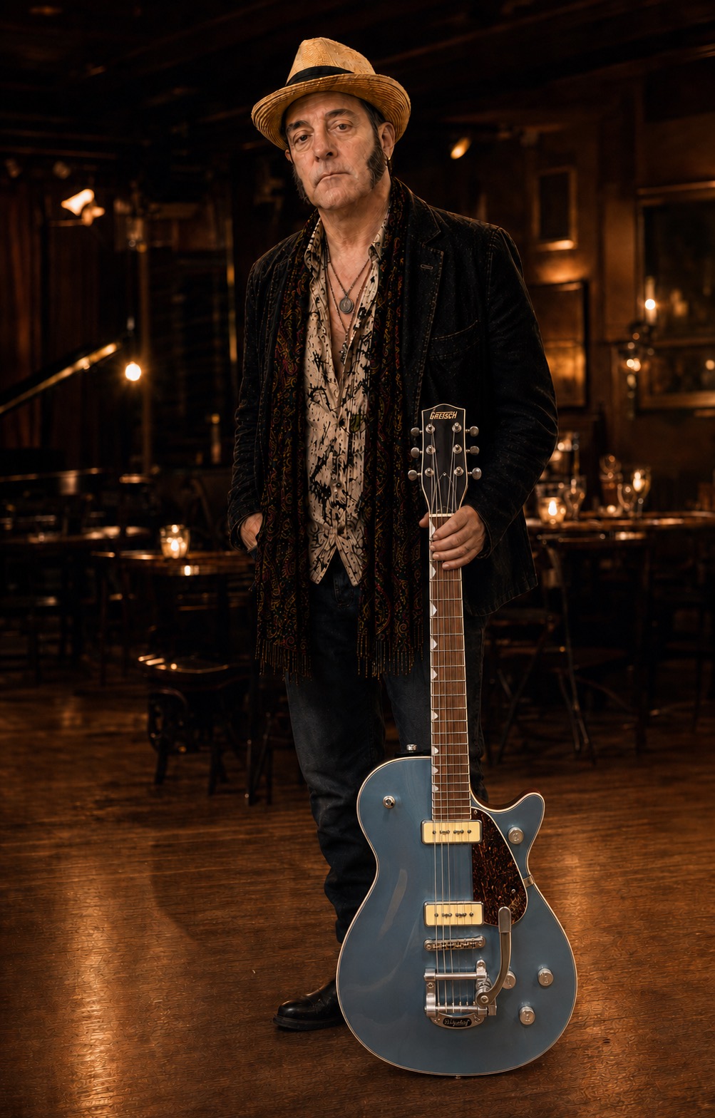 Eric Kauschen with his blue Gretsch guitar